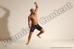 Underwear Gymnastic poses Man Black Muscular Bald Dancing Dynamic poses Academic